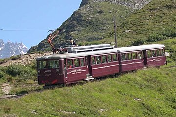 An image of the Tramway du Mont Blanc passing through Les Houches Chamonix in summer