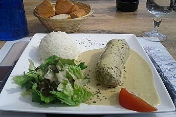 an image of a creamy intestine dish with a bowl of rice and salad