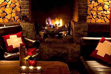 The fire and sofas at the Lounge in Verbier