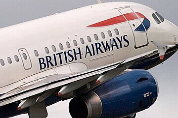 A british airways plane is flying through the air