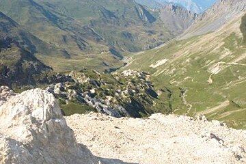 A view of a mountain valley from the top of a mountain