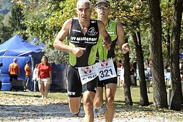 A man running with a sign that says 321 on it