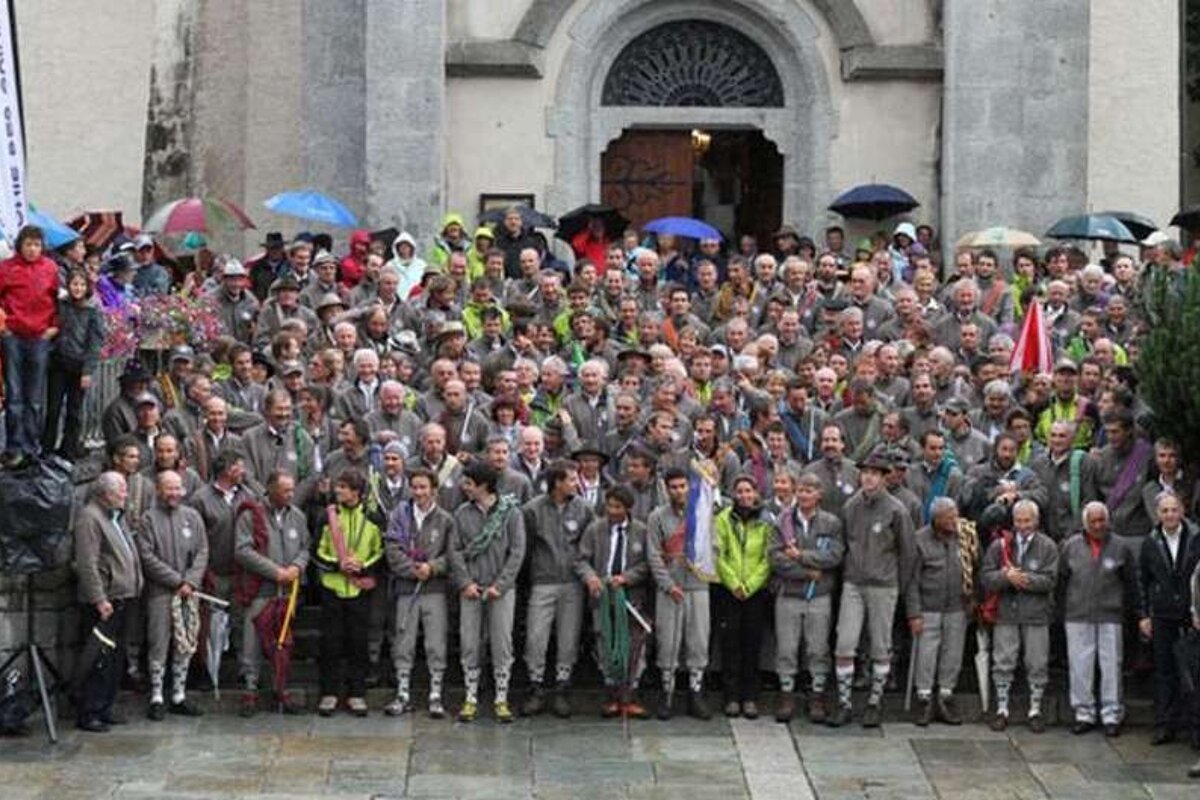 An image of Chamonix Mountain Guides Compagnie des Guides in front of the Chamonix Church Eglise St Michel for the Fete des Guides, annual event in August