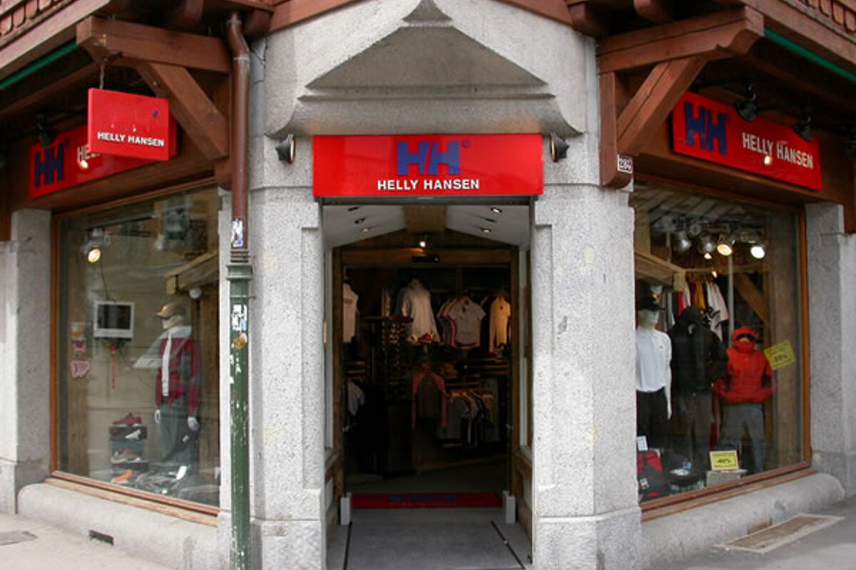 A store front with a red sign that says helly hansen