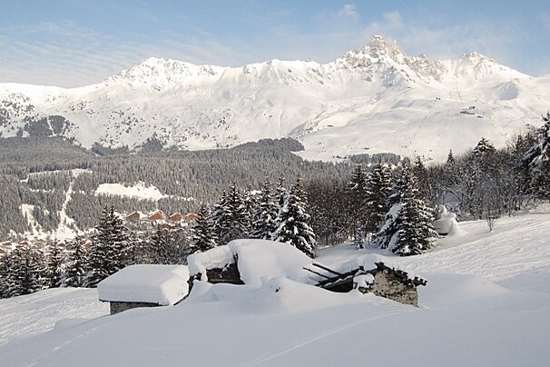 ruined barns in snow