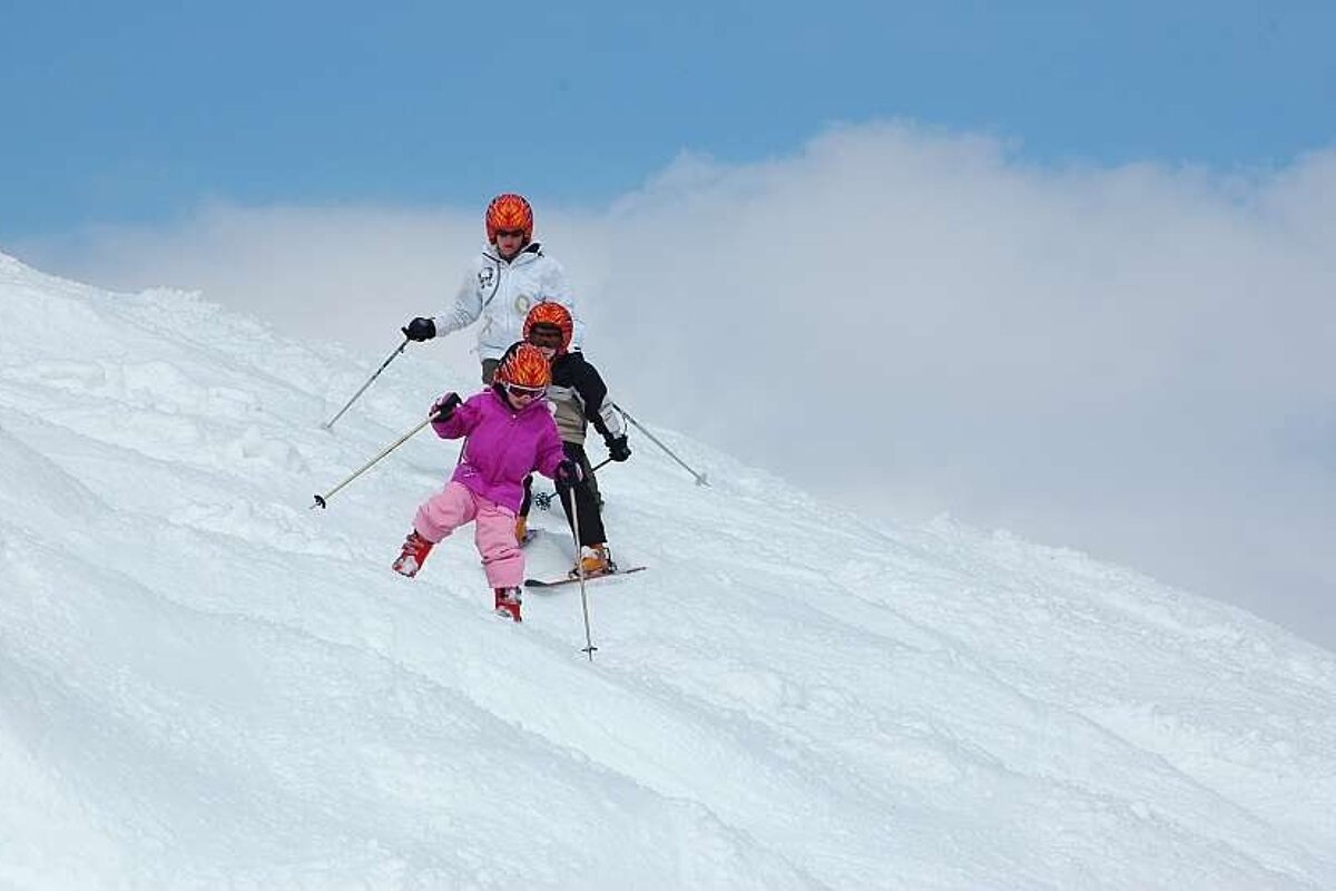 An image of children skiing off piste in Val d'Isere