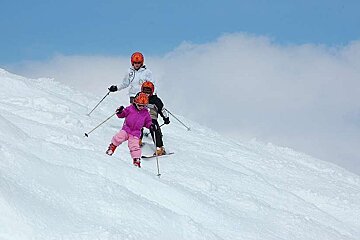 An image of children skiing off piste in Val d'Isere