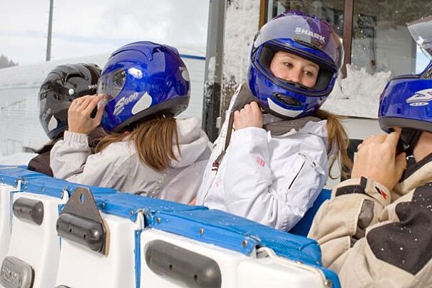 people putting helmets on for the Bobsleigh