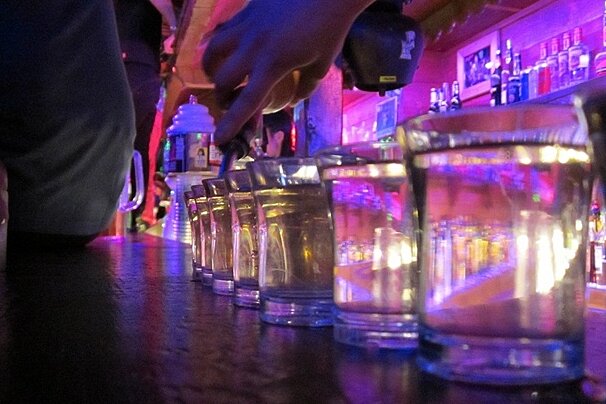 A row of shot glasses with the letter a on them