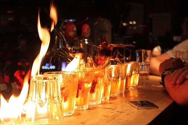 An image of flaming sambucas in Monkey Bar in Chamonix Mont Blanc