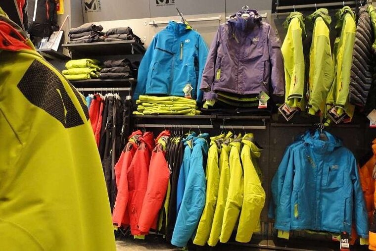 an image of a shop selling bright coloured ski jackets and pants