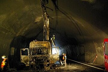 A truck is sitting in the middle of a tunnel