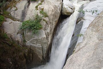 A waterfall in the middle of a rocky area