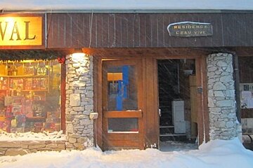 Door to apartments and bar (not visible)