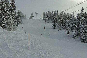 Skiers heading down to resort after fresh snow brings in good cover low down