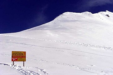 A snowy mountain with a sign that says restaurant bar