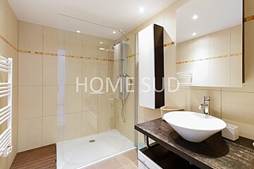 A bathroom with the word home on the wall