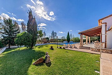 A large house with a swimming pool in the backyard