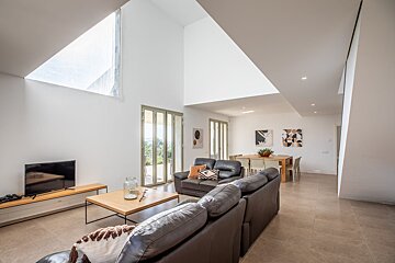 A living room with a couch and a flat screen tv