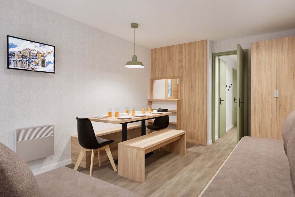 A modern dining/living room with light wood furniture, including a table with benches and chairs. A TV hangs on a textured wall, next to a hallway with a light green door.