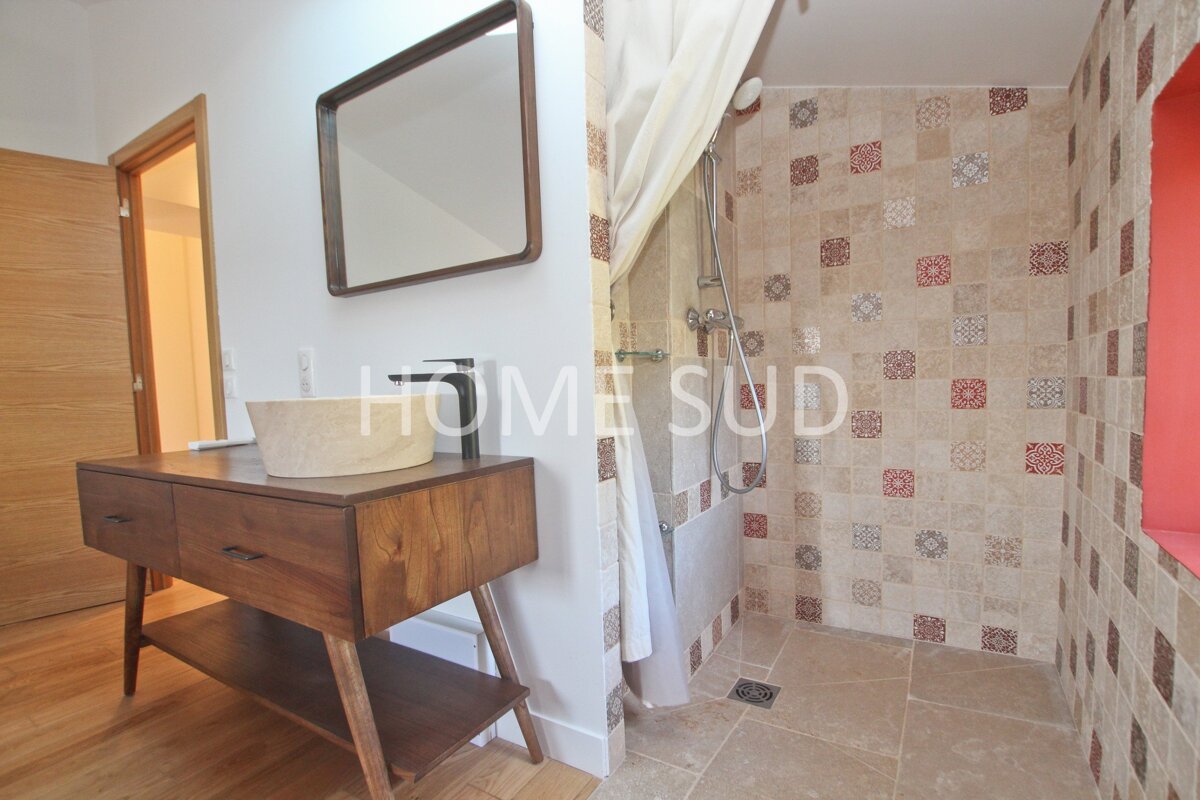 A bathroom with the word home on the wall