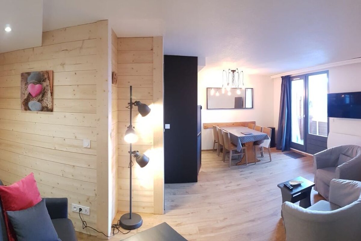 A living room with a couch and a chair