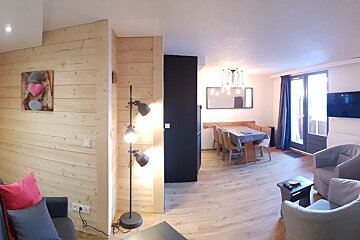 A living room with a couch and a chair