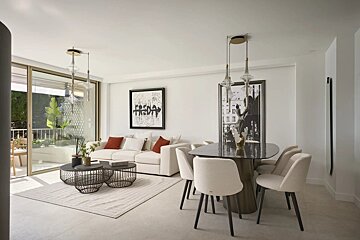 A bright, modern open-plan living and dining room with a white sofa, black dining table, and sliding glass doors to a balcony.