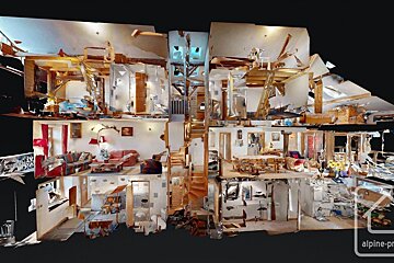 A detailed 3D digital cutaway model of a multi-story house interior, showcasing furnished rooms, hallways, stairs, and structural elements.