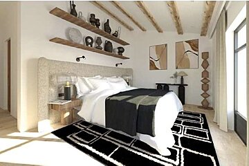 A bedroom with a bed , nightstand , rug and shelves
