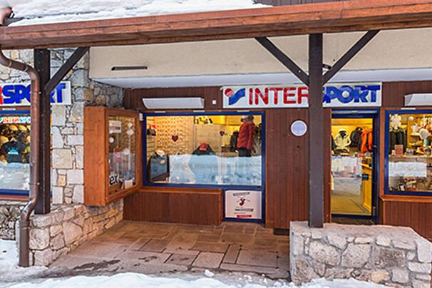 A store front with a sign that says ' intersport ' on it