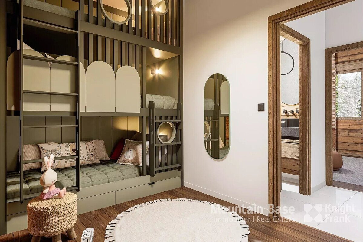 Stylish olive green custom bunk beds dominate a modern kids' room with a ladder, plush bedding, toy bunny, white rug, and wood floor.
