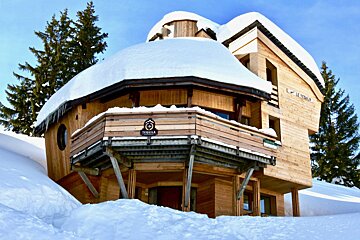 A snowy house with the name le torria on it