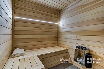 A wooden sauna with the words mountain base knight frank on the bottom