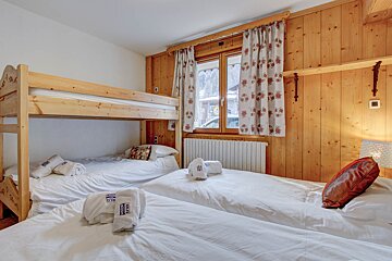A bunk bed with a towel that says montana on it