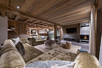 A living room filled with furniture and a fireplace