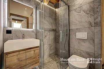 A bathroom with a knight frank logo on the bottom