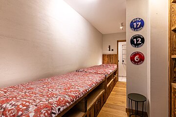 A bedroom with a sign that says home 17