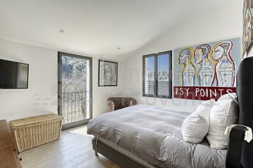 A bedroom with a painting on the wall that says psy points