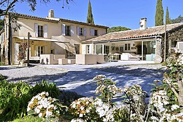 A large house with a patio in front of it