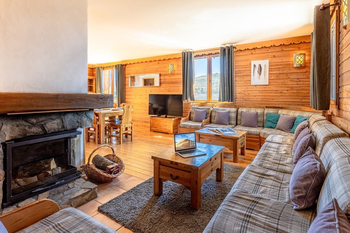 A living room with a couch and a fireplace