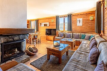 A living room with a couch and a fireplace