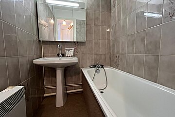 A bathroom with a sink and a bathtub