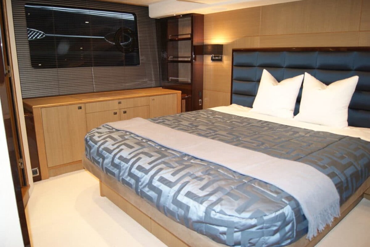 A bed with a greek key pattern on it