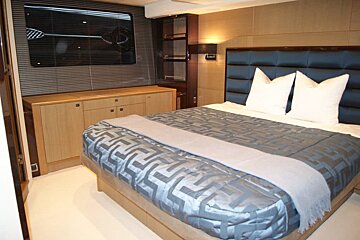 A bed with a greek key pattern on it