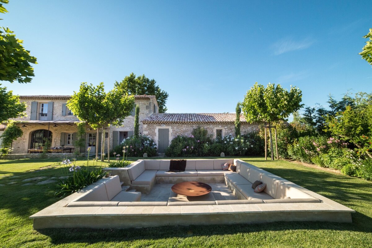 A house with a large couch in front of it