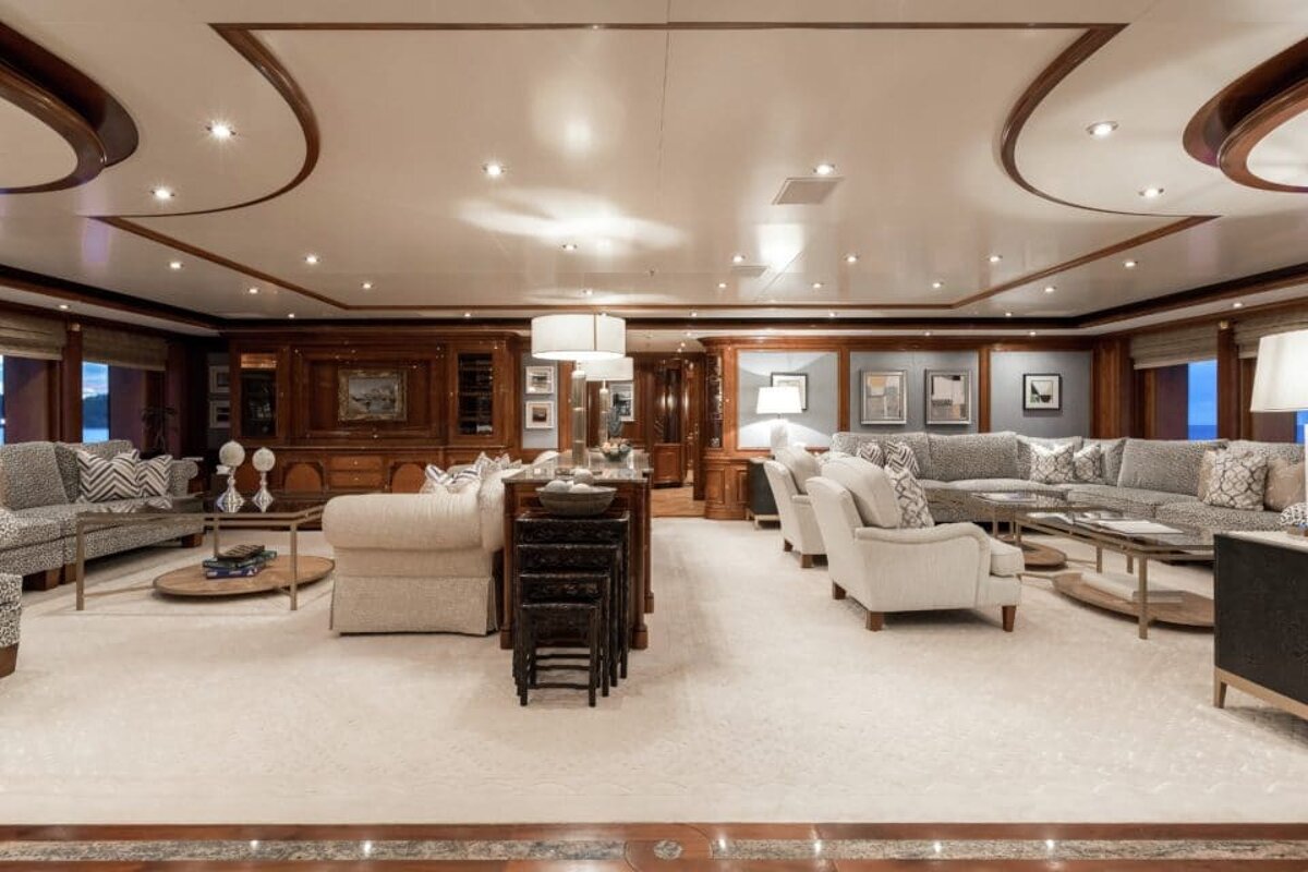 A large living room with a couch and chairs