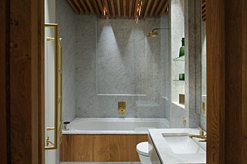 A bathroom with a bathtub and a toilet