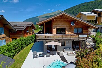 A house with a hot tub in front of it