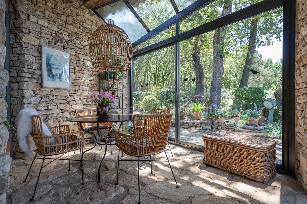 A room with a table and chairs and a picture on the wall